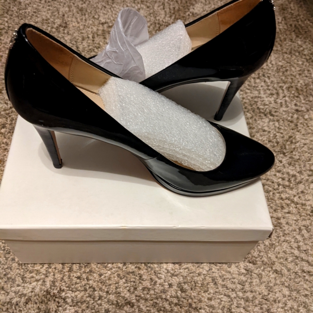 Coach black patent leather size 8M pumps.